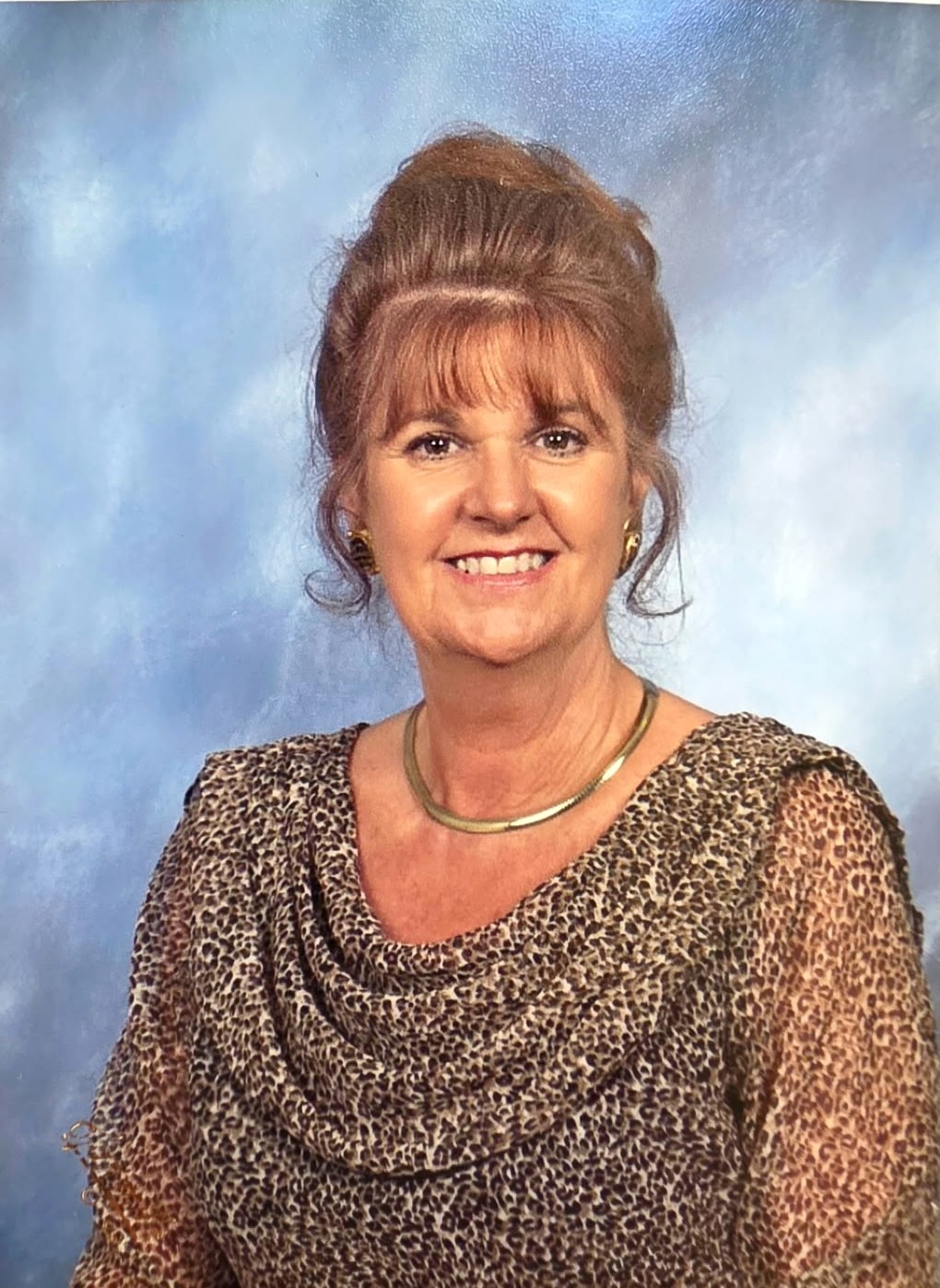 Norma smiling in her formal portrait